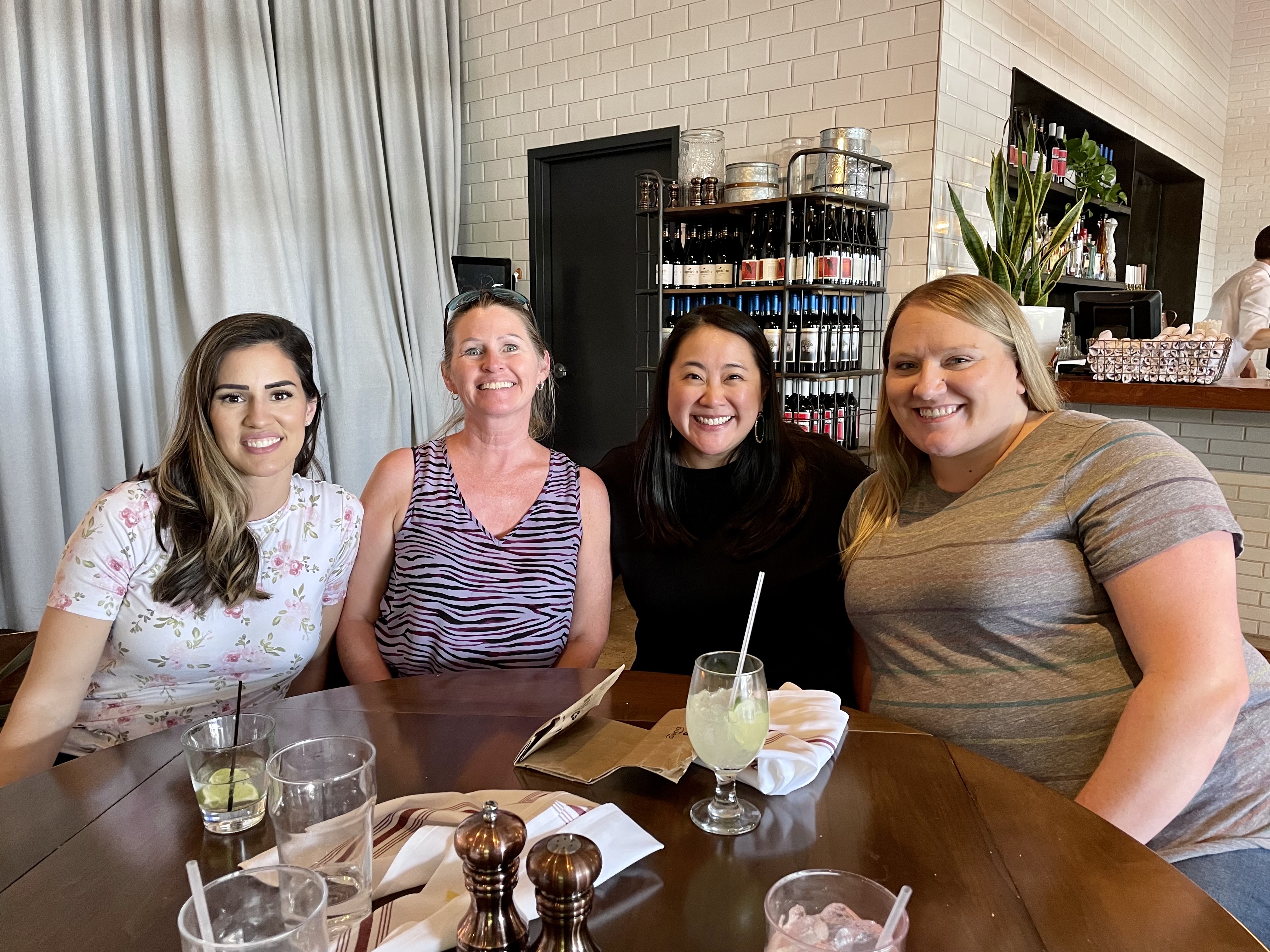 Group photo at table in restaurant.